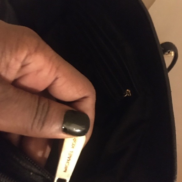 This Michael K bag is still in good use,wear on strips but no stains. - Picture 4 of 5